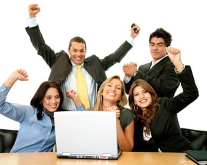 Business team in an office excited from their success